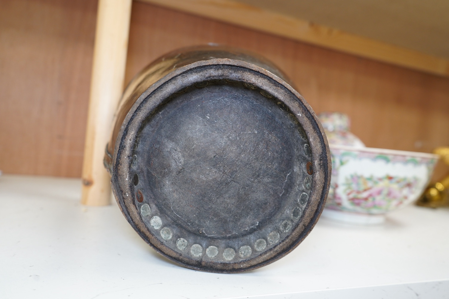 A Georgian mounted leather fire bucket (waste paper bin), 27cm high. Condition - fair